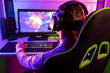 gamer playing indoor side view